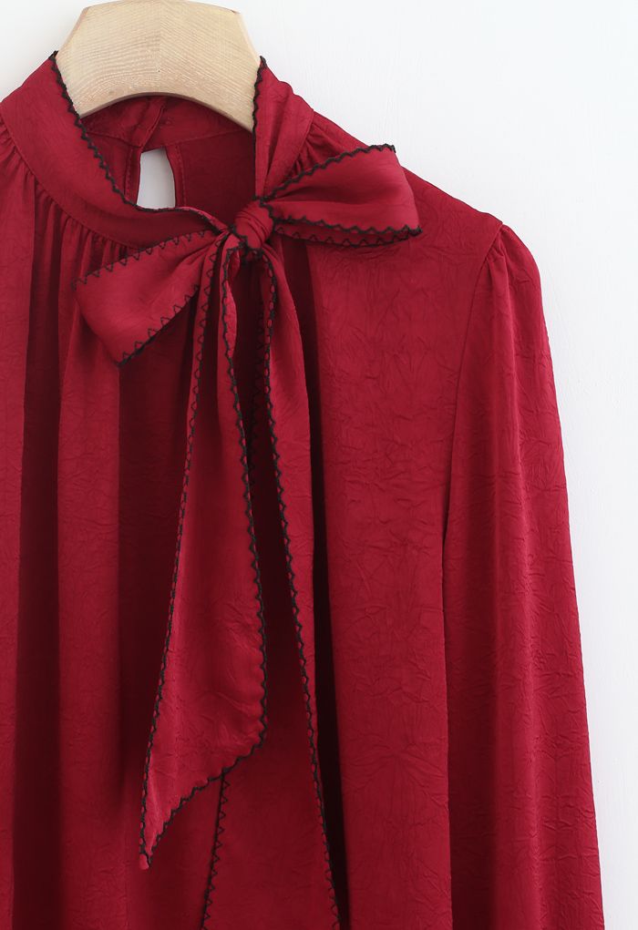 Seamed Edge Bowknot Textured Satin Top in Red