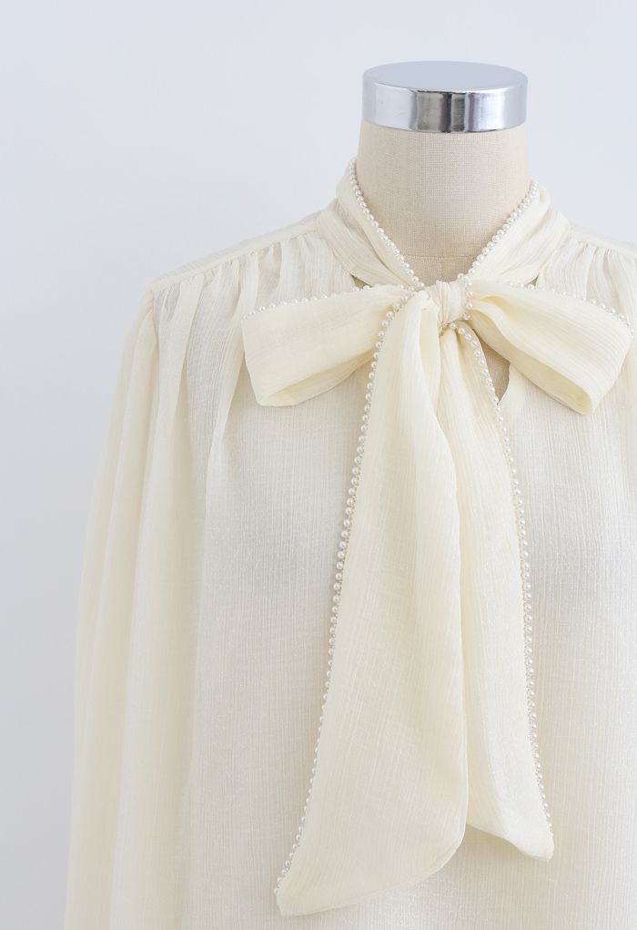 Bowknot Pearl Trim Semi-Sheer Shirt in Cream