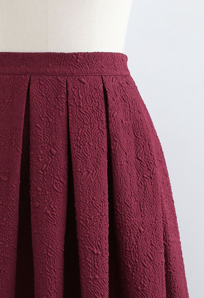 Carnation Embossed Satin Pleated Midi Skirt in Burgundy