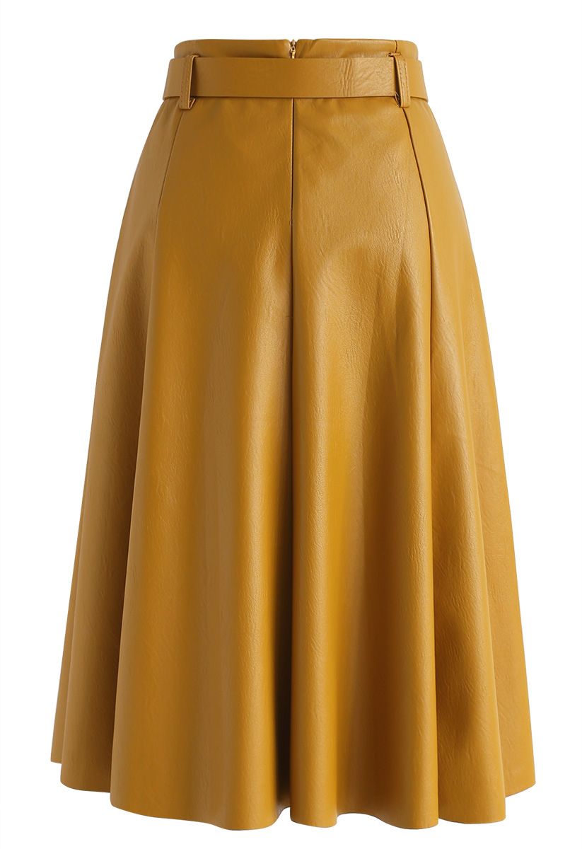 The Night Wind Faux Leather Midi Skirt in Mustard