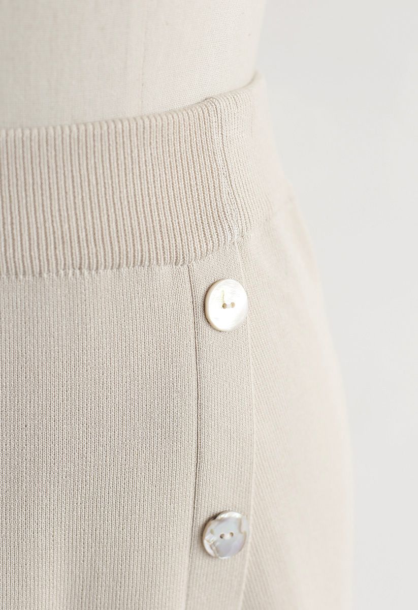 Shell Buttons Trim Asymmetric Knit Skirt in Cream