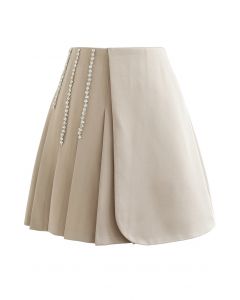 Crystal Chain Decorated Pleated Flap Mini Skirt in Sand